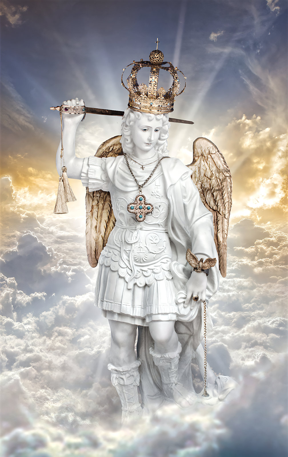 A statue of an angel holding a sword and wearing a crown, set against a cloudy sky